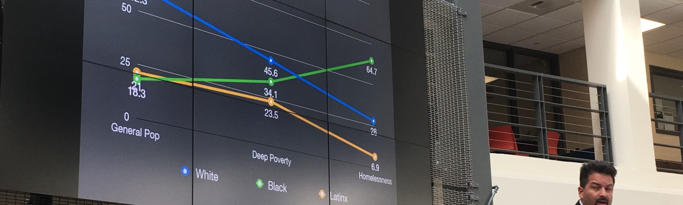 Jeff Olivet, senior advisor to the Center for Social Innovation shows data on the impact of homelessness on African American, Latino and white communities. Photo by Tamela Luce.